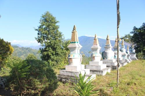 a row of temples on top of a hill at Silent Echo Farm Stay in Māngwa