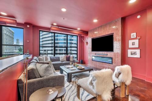 a living room with a red wall at Nashville Elvis Suite 4BR by Maddox Hotel in Nashville