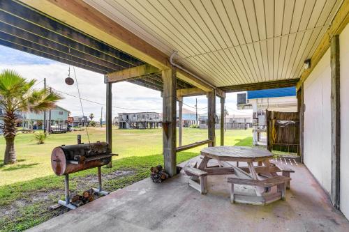 a porch with a picnic table and a grill at Intracoastal Views and Deck Surfside Beach Home in Surfside Beach