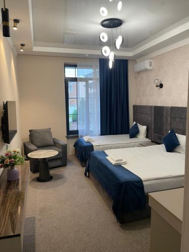 Postel nebo postele na pokoji v ubytování Zangu Hotel