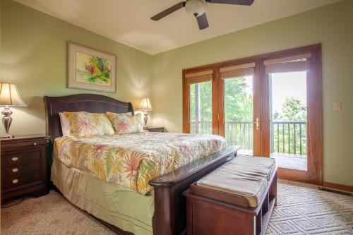 a bedroom with a bed and a window at Majestic View cabin in Bryson City: 4BR, lake views, sleeps 10—your perfect mountain escape! in Bryson City