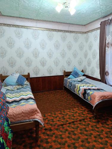 Postel nebo postele na pokoji v ubytování Paradise guest house