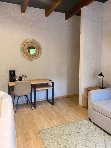a room with a table and a bed and a mirror at Hacienda Álamos in Laborcillas