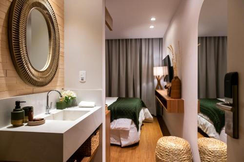 Katil atau katil-katil dalam bilik di Canto Hotel