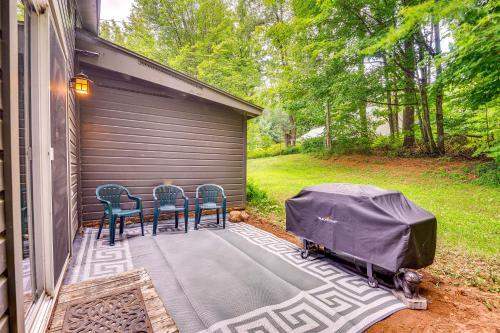 a patio with chairs and a table with a tent on it at 1 Mi to Brantingham Lake New York Getaway! in Glenfield
