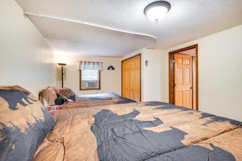 a bedroom with a large bed in a room at 1 Mi to Brantingham Lake New York Getaway! in Glenfield