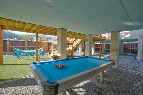 a pool table in a yard with a hammock at Charming Downtown Bryson City SkyLoft Apt 1 - Perfect for Couples! in Bryson City