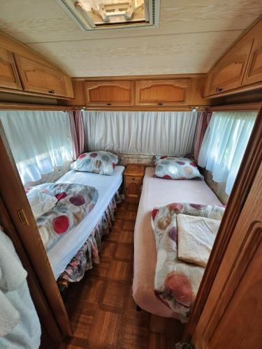 two beds in the back of an rv at Zew Natury in Skorka