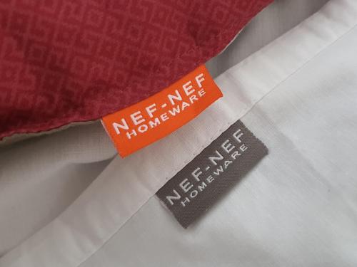 an orange tag sitting on top of a bed at MANDO PATRASSO - Clasical apartment in the center of Patras with free parking in Patra