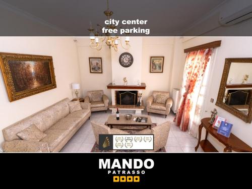 a living room with a couch and a fireplace at MANDO PATRASSO - Clasical apartment in the center of Patras with free parking in Patra
