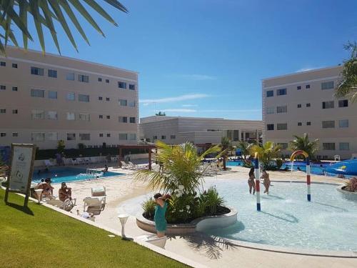 a group of people in a pool at a resort at Encontro das Águas Thermas Resort - Caldas Novas, Goiás in Caldas Novas