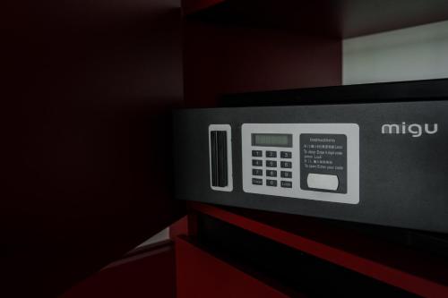 a microwave oven sitting on top of a cabinet at Arkadia Beach Hotel in Odesa