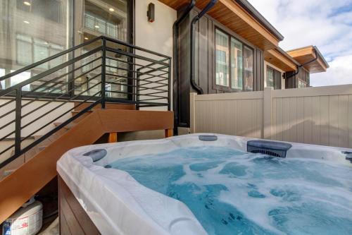 a jacuzzi tub on the balcony of a house at Klaim Retreats 807 in Park City