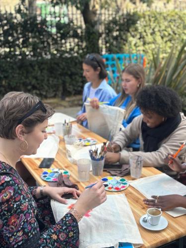 a group of women sitting at a table at YellowSquare Florence in Florence