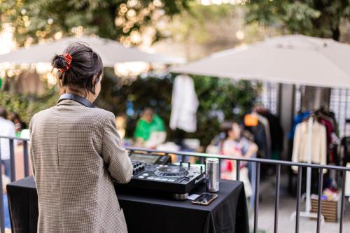 a woman standing in front of a table with a mixer at YellowSquare Florence in Florence