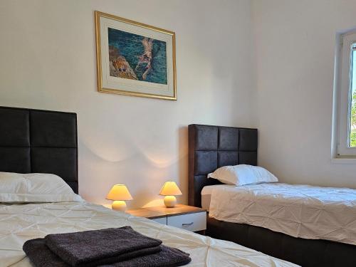 Posteľ alebo postele v izbe v ubytovaní Apartments Maček