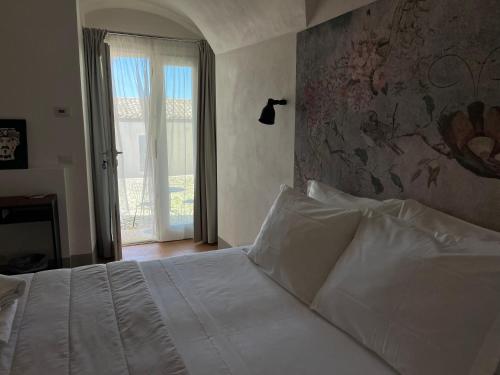 Postel nebo postele na pokoji v ubytování Dimora di Dante