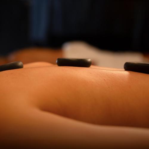 a close up of the back of a cushion with two pens at Hotel Zensual in Bogotá