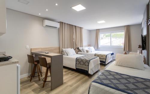 Katil atau katil-katil dalam bilik di Villary Flats Gramado