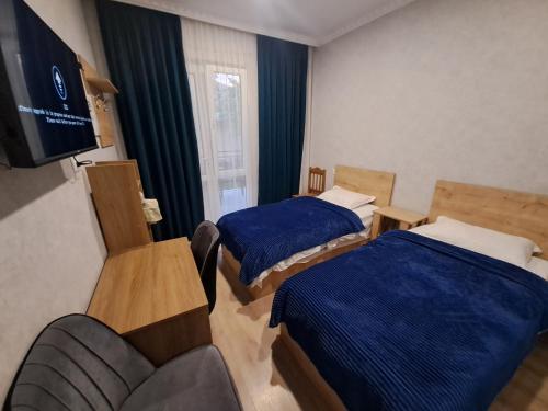 Llit o llits en una habitació de Guest House "AKHALTSIKHE"
