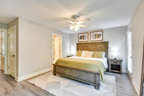 a bedroom with a bed and a ceiling fan at Walk to Main St and River Downtown Helen Condo in Helen