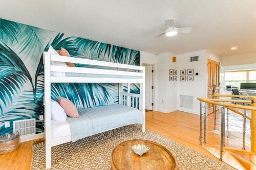 a bedroom with a bunk bed with a palm tree mural at Walk to Gulf Luxe Luau-Themed Gem in Holmes Beach in Holmes Beach