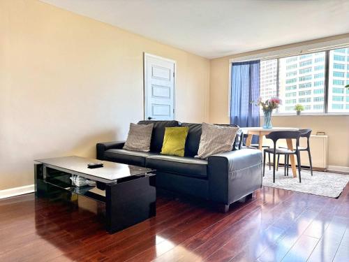 a living room with a couch and a table at ATL Downtown City View Onsite Parking LM802 in Atlanta