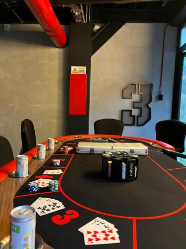 a poker table with playing cards and poker chips on it at Loft Apartamentos Lleras in Medellín