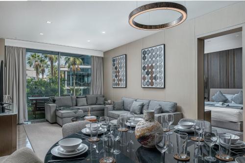 a living room with a table and a couch at FIVE Palm Jumeirah Premier Apartments in Dubai
