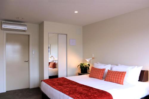 Säng eller sängar i ett rum på Quest Taupo