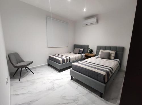 Postel nebo postele na pokoji v ubytování New apartment on the ground floor in CUN