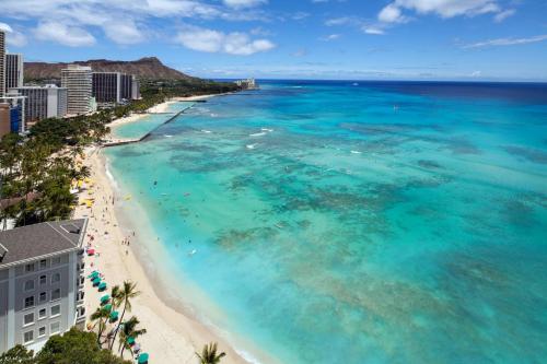 an aerial view of a beach and the ocean at Moana Surfrider, A Westin Resort & Spa, Waikiki Beach in Honolulu