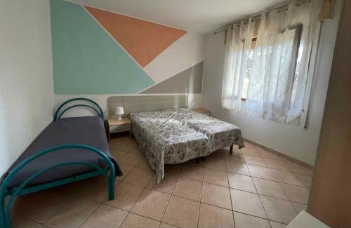 Postel nebo postele na pokoji v ubytování Apartments in Rosolina Mare 24864