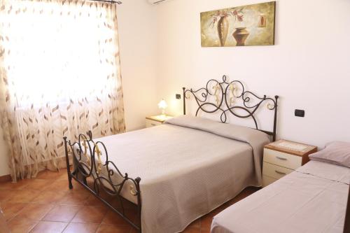 Postel nebo postele na pokoji v ubytování Villa Francesca con ampio giardino