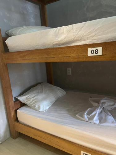 a couple of bunk beds with the number on them at Hostel Barra in Salvador