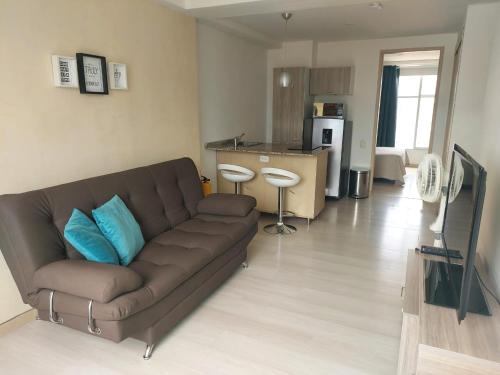 Posezení v ubytování Lovely one bedroom condo in beautiful Laureles
