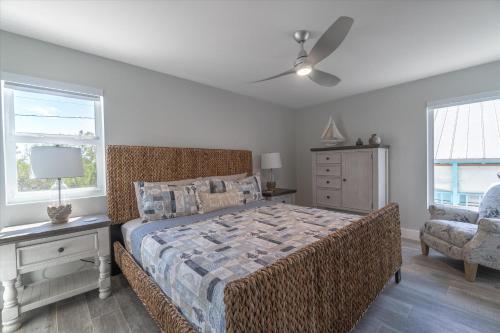 a bedroom with a bed and a ceiling fan at Yeya's Hideaway in Big Pine Key