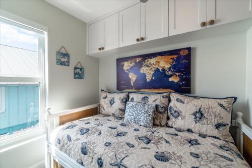 a bedroom with a bed with a map on the wall at Yeya's Hideaway in Big Pine Key