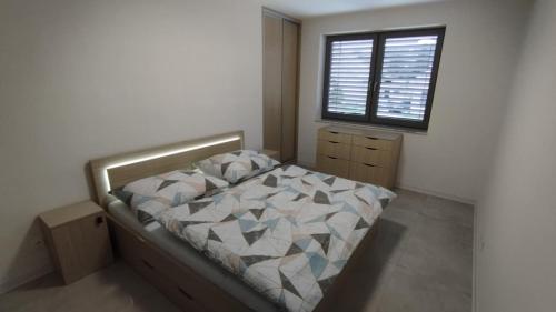 Postel nebo postele na pokoji v ubytování Apartmány Anami