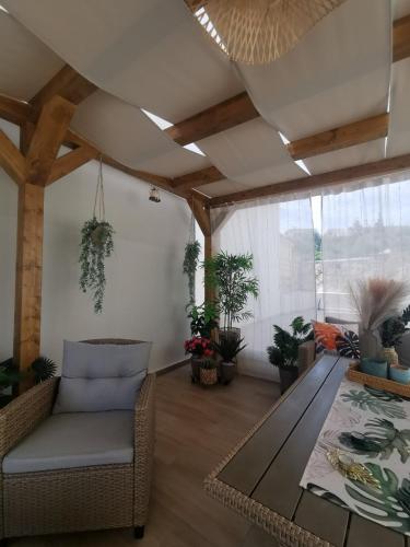 a living room with a couch and a table at Robellini Palm in Kounoupidhianá