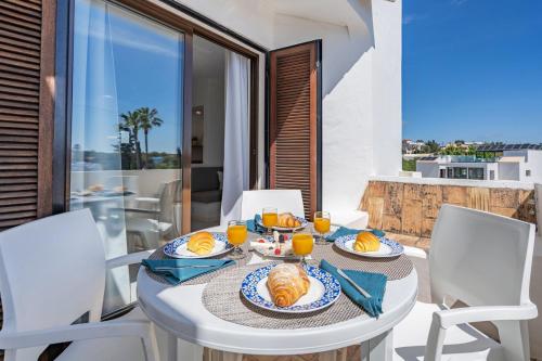 Sunny Flat with a Balcony & Pool by HostWise