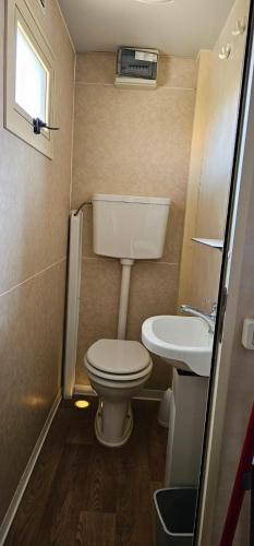 a small bathroom with a toilet and a sink at STELLA MARINA campling in Casa Franciana