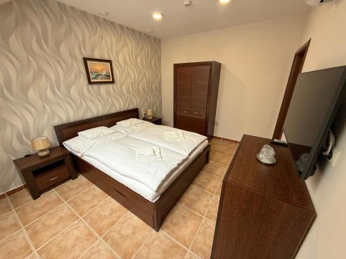 Posteľ alebo postele v izbe v ubytovaní Spa & Wellness Hotel Orchidea