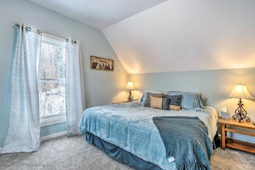 a bedroom with a bed and a window at Mount Holly Vacation Rental with Hot Tub! in Mount Holly Heights