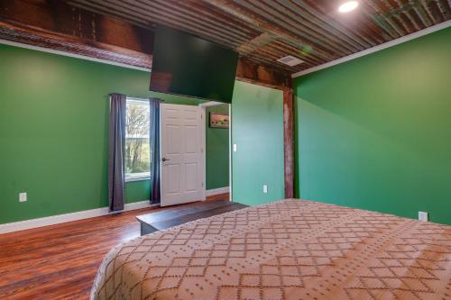 a bedroom with green walls and a bed at Near Wineries Country Condo in New Haven in New Haven