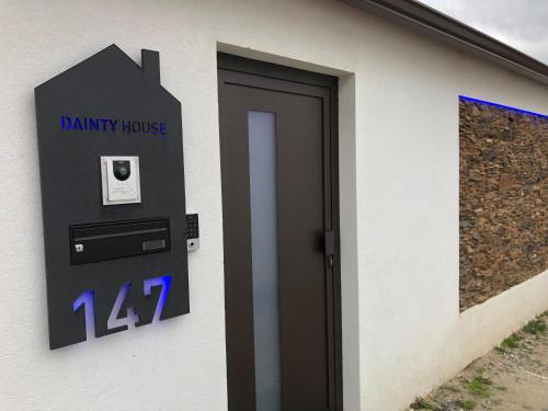 a parking meter on the side of a building at Dainty House in Ovar