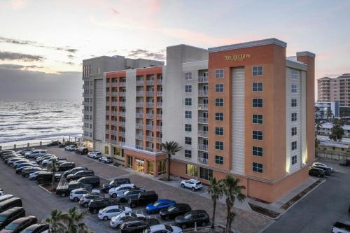 a rendering of a hotel with cars parked in a parking lot at Residence Inn by Marriott Daytona Beach Oceanfront in Daytona Beach