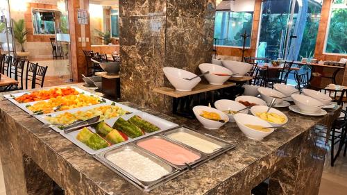 a buffet with many different types of food on a table at Hotel Palacio Maya in Mérida