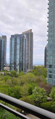 a view of a city skyline with tall buildings at Lovely condo near Lake Ontario in Toronto