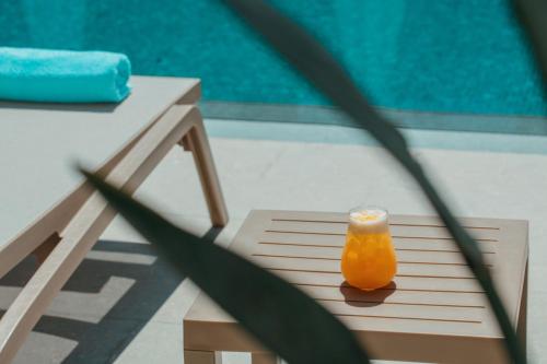 a candle sitting on a table next to a pool at Casa Lumar Luxury Lodging- Adult Only in Fethiye